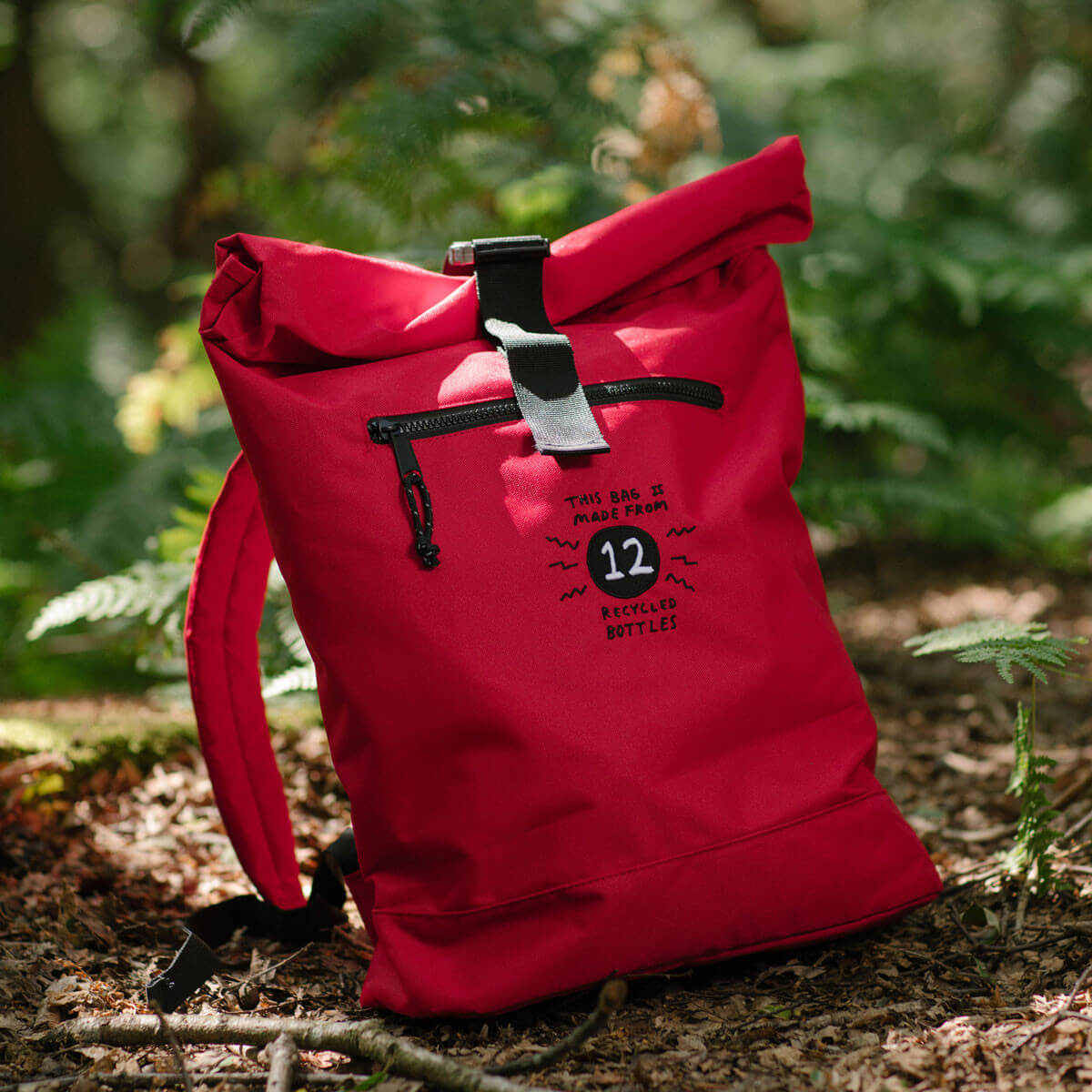 Image of red backpack in woodland scene