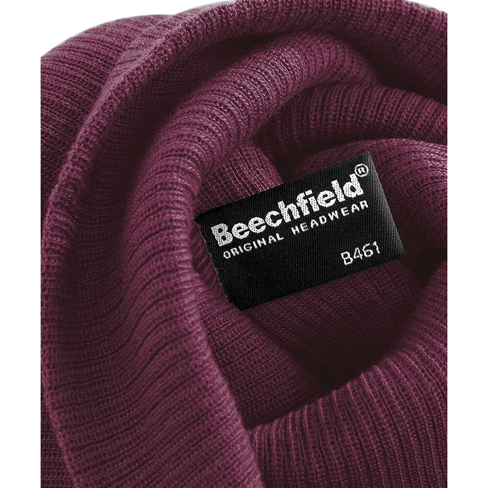 close up of the inside of a burgundy slouch beanie