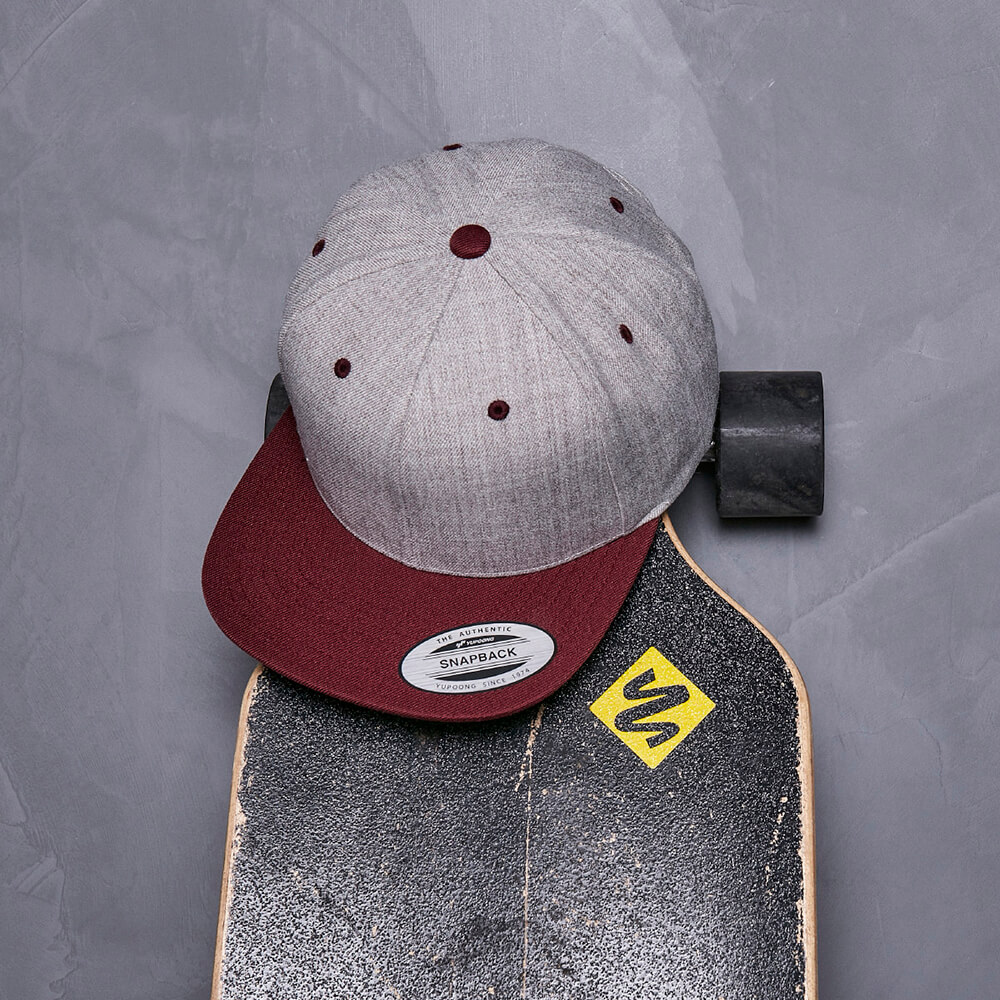 Image of a cap resting on a skateboard